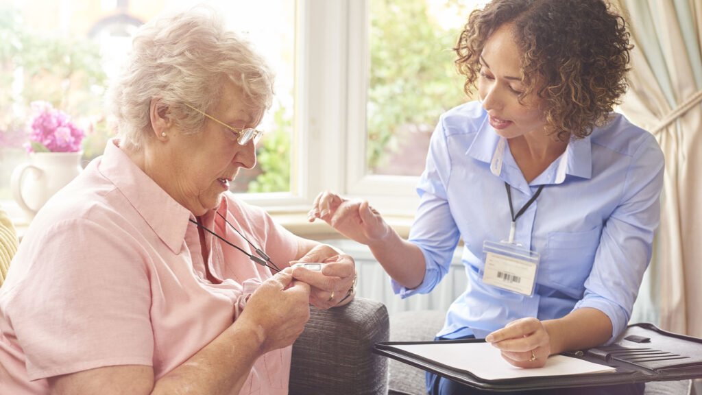 Carer helping client with badge